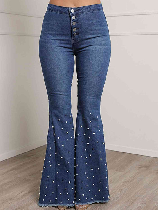 Jeans acampanados con bragueta de botones