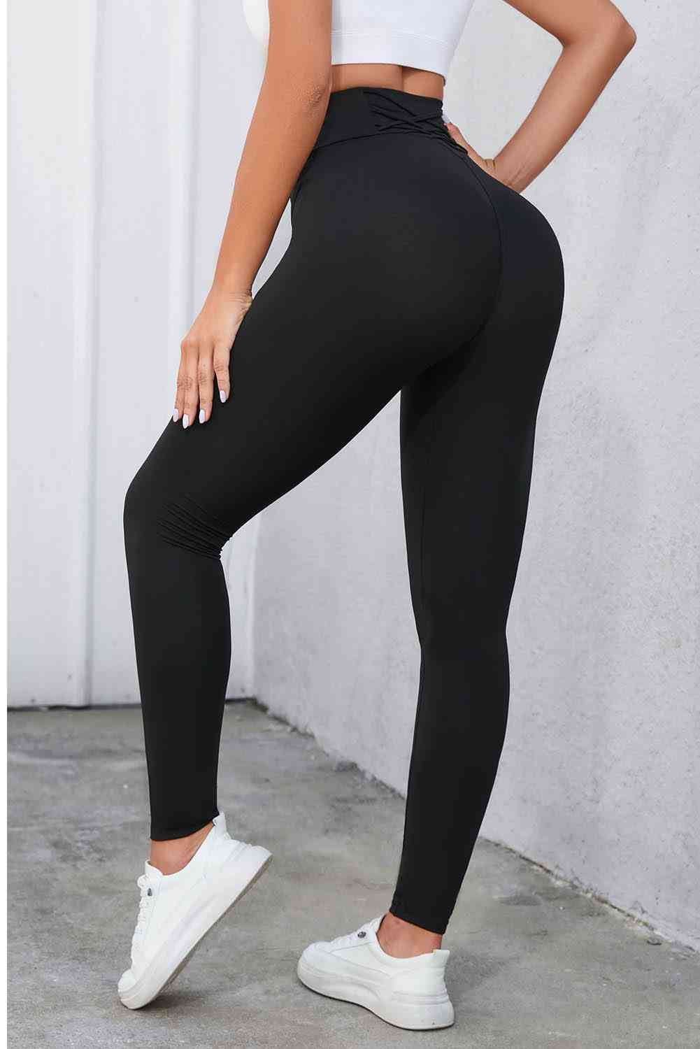 Leggings con cintura ancha y detalle cruzado