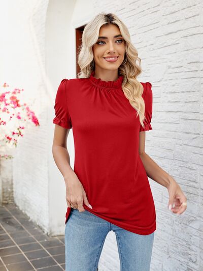 Blusa con volantes y cuello simulado