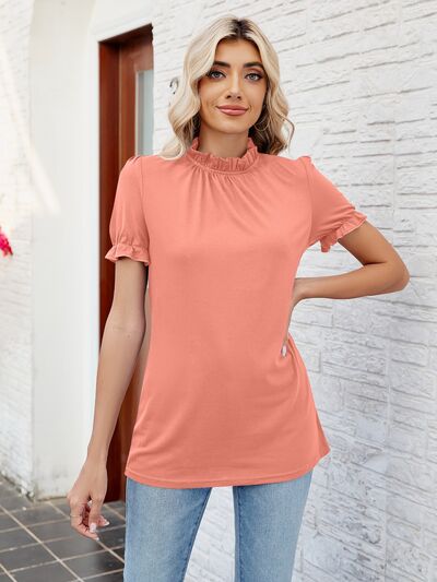 Blusa con volantes y cuello simulado