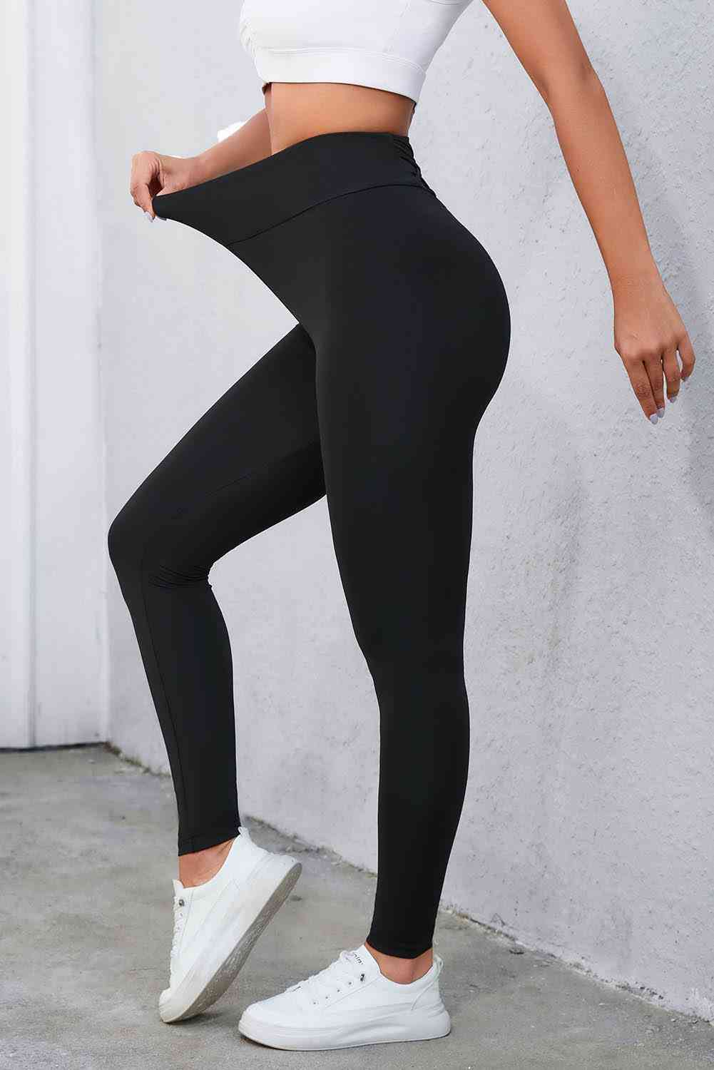 Leggings con cintura ancha y detalle cruzado