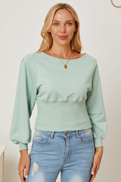 Blusa con mangas farol y cuello barco